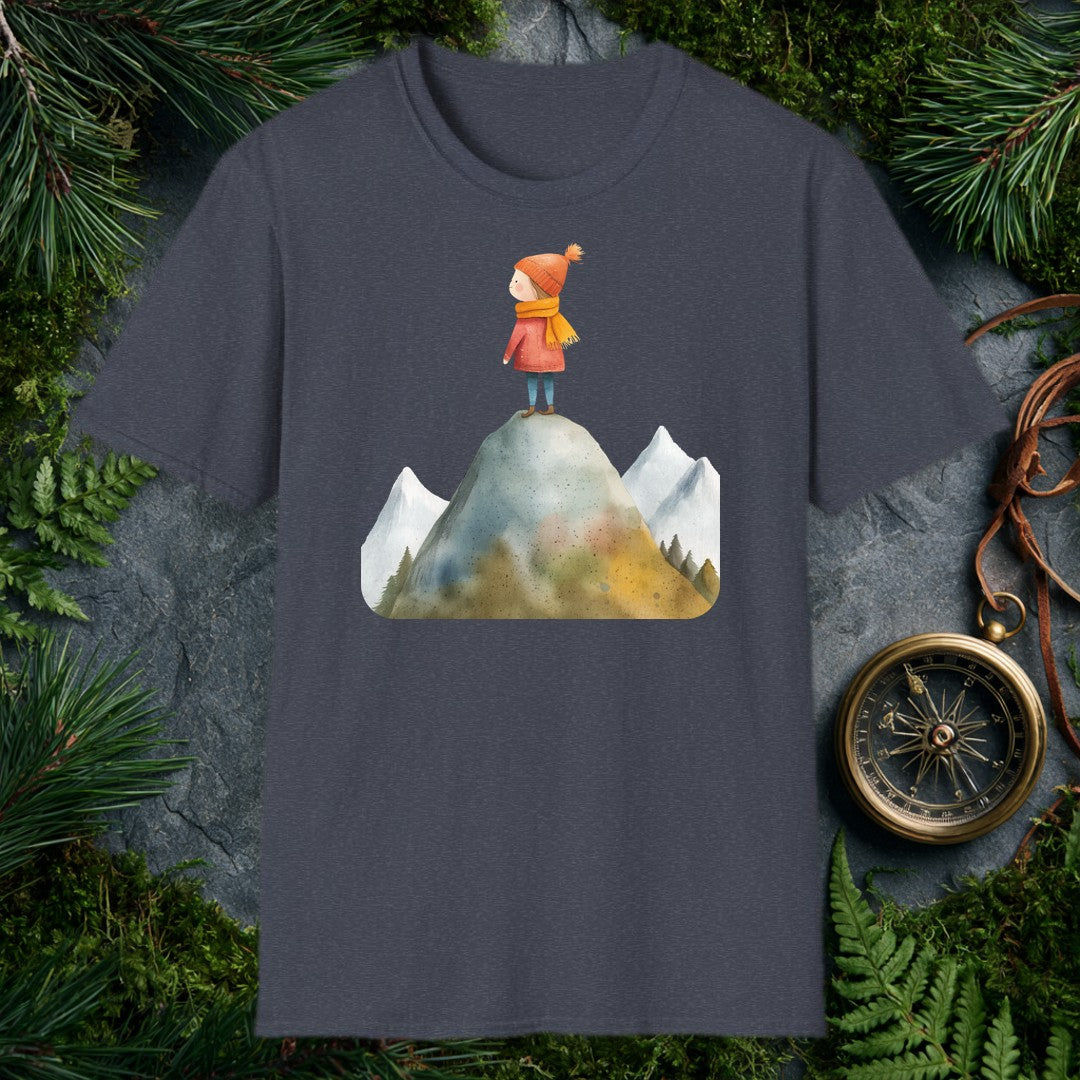 A small figure in a red coat and orange knit hat stands at the top of a rocky peak, pine-rimmed mountains fading blue behind her — for the hiker who knows that…