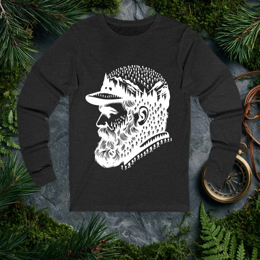 A bearded man in a trail cap looks west while pine forests, jagged peaks, and a parade of hikers — and a few unmistakable Bigfoot silhouettes — fill the…