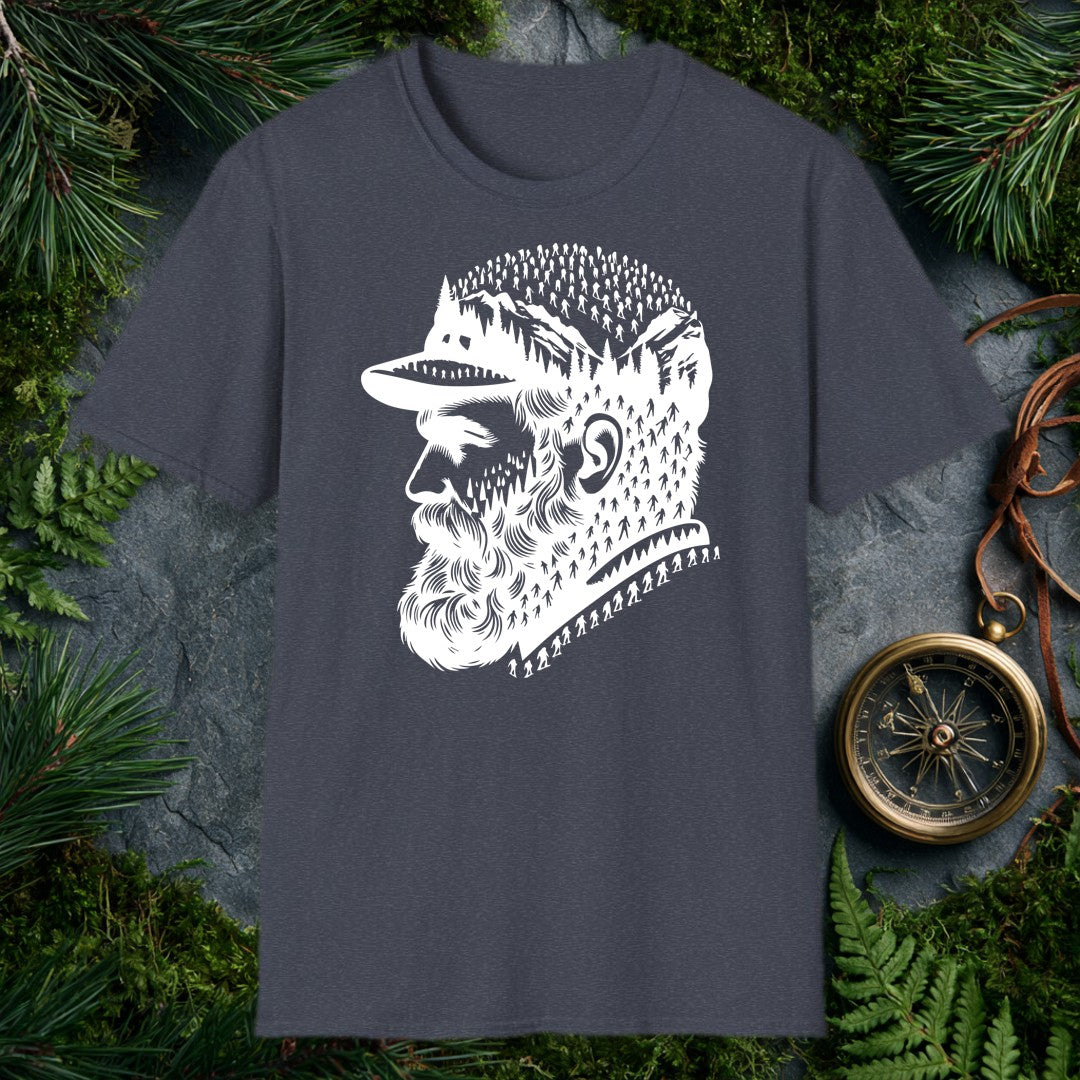 A bearded man in a trail cap looks west while pine forests, jagged peaks, and a parade of hikers — and a few unmistakable Bigfoot silhouettes — fill the…