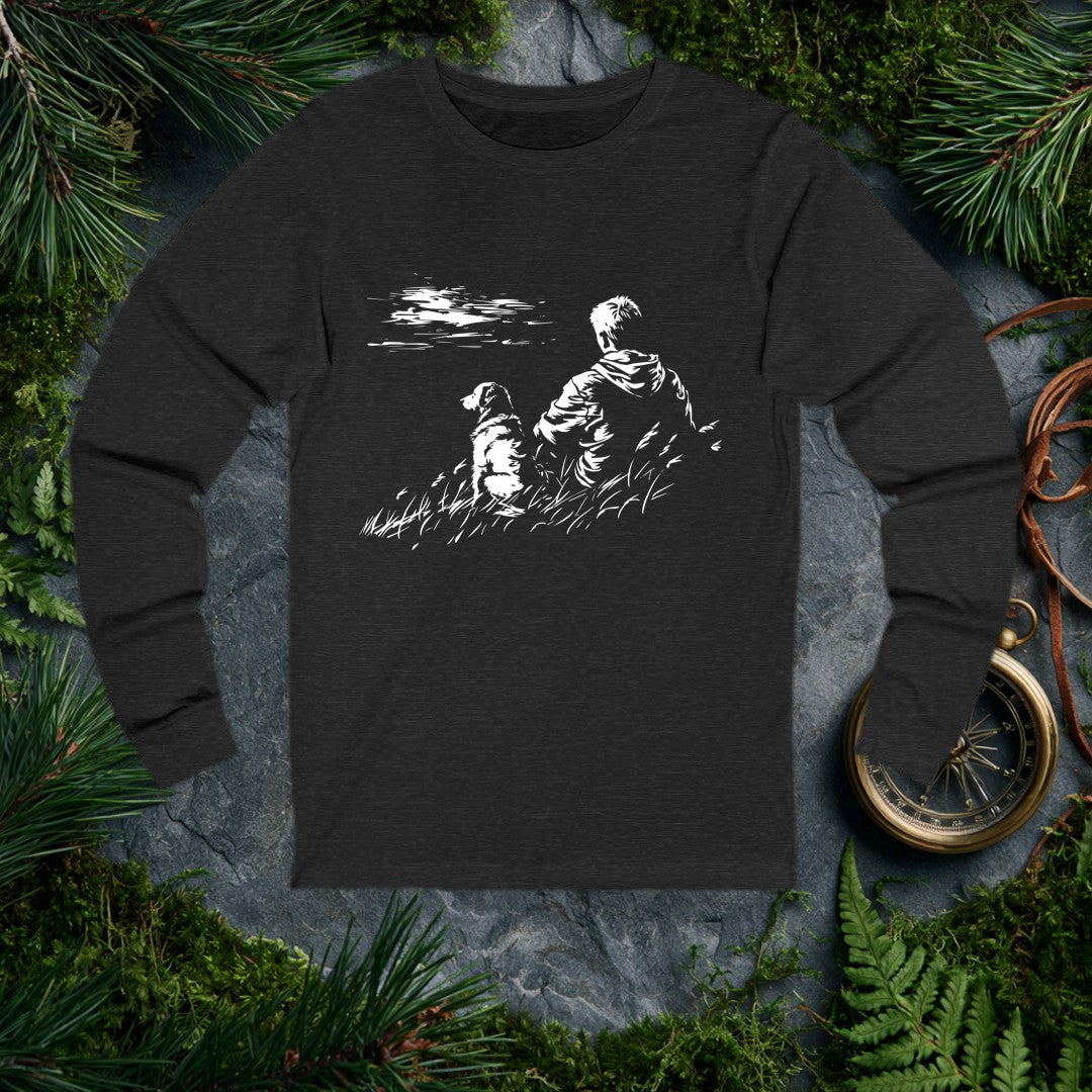 A kid and his dog sit side by side in tall grass, both watching something out across the water — the quiet kind of afternoon you don't forget. For anyone who…