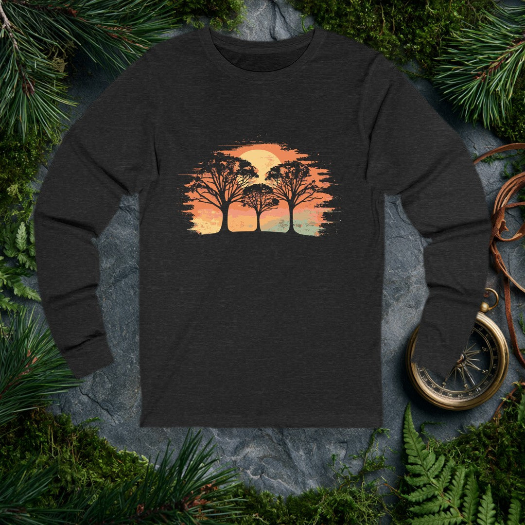 Three bare-branched trees stand against a wide burnt-orange sky, a pale gold sun rising full behind them — for the person who stops on the trail just to watch…