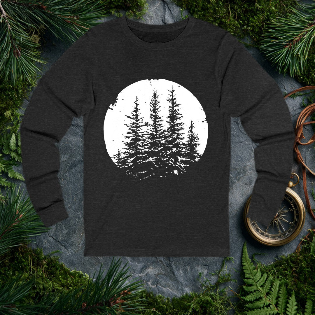 Three snow-laden spruce trees rise against a deep black sky, framed in a worn circular vignette — made for the person who knows what a cold, quiet forest…