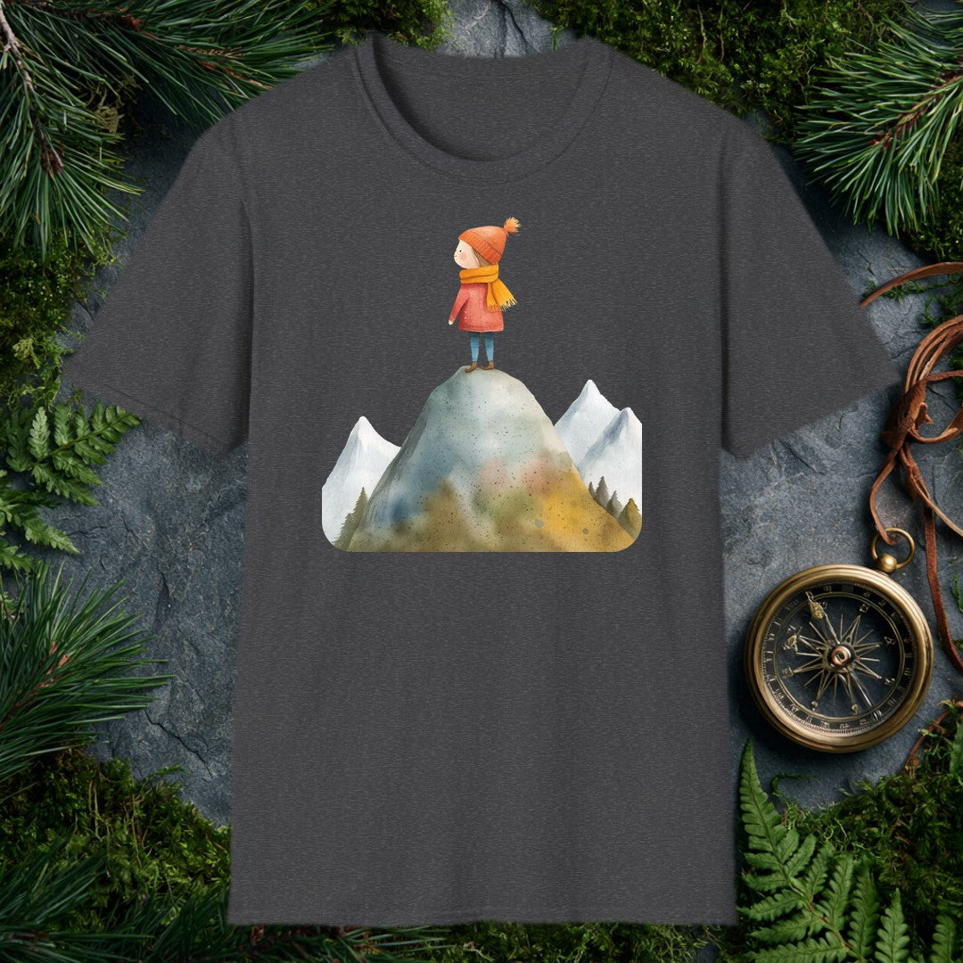 A small figure in a red coat and orange knit hat stands at the top of a rocky peak, pine-rimmed mountains fading blue behind her — for the hiker who knows that…
