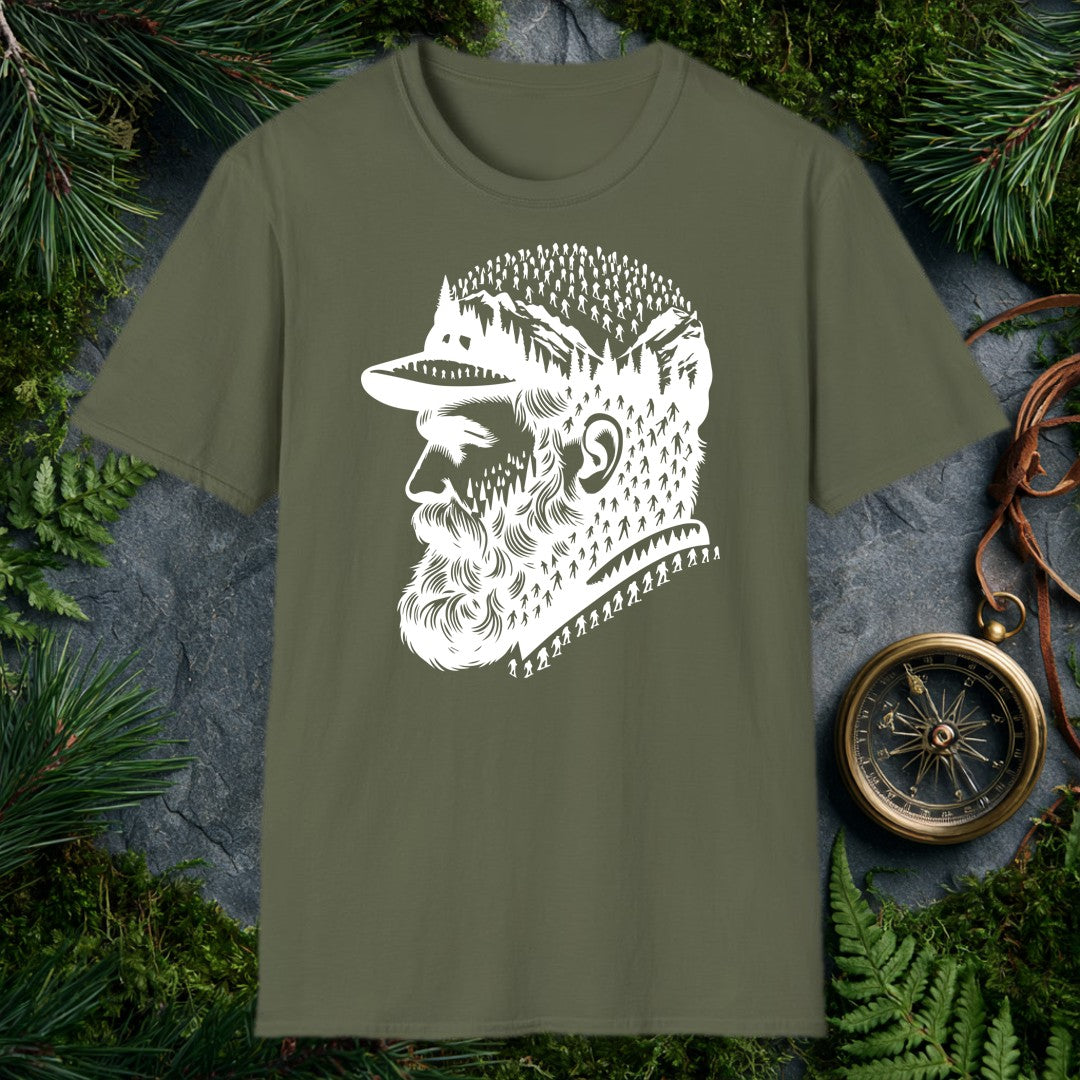A bearded man in a trail cap looks west while pine forests, jagged peaks, and a parade of hikers — and a few unmistakable Bigfoot silhouettes — fill the…