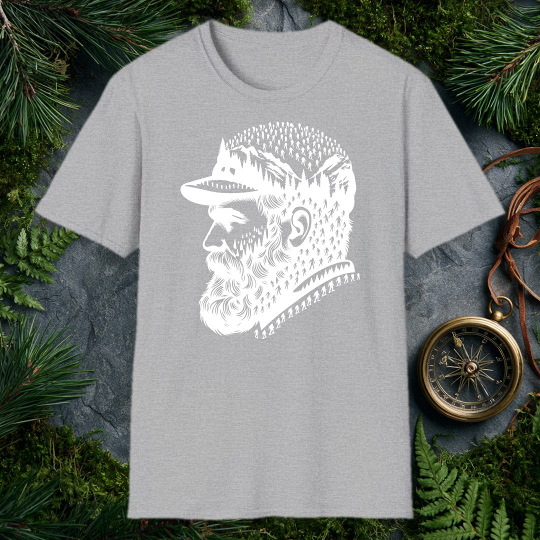 A bearded man in a trail cap looks west while pine forests, jagged peaks, and a parade of hikers — and a few unmistakable Bigfoot silhouettes — fill the…
