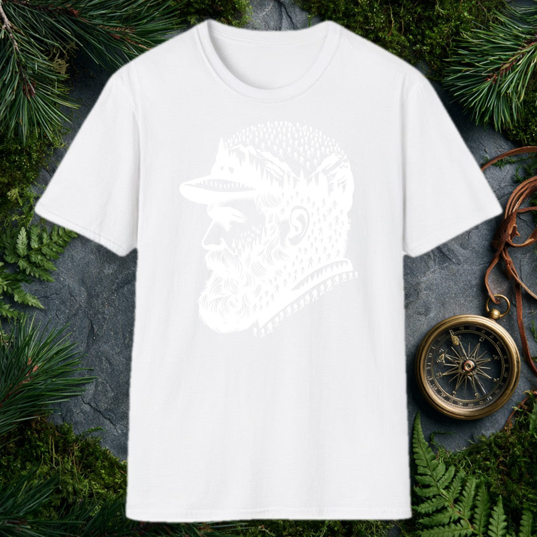 A bearded man in a trail cap looks west while pine forests, jagged peaks, and a parade of hikers — and a few unmistakable Bigfoot silhouettes — fill the…