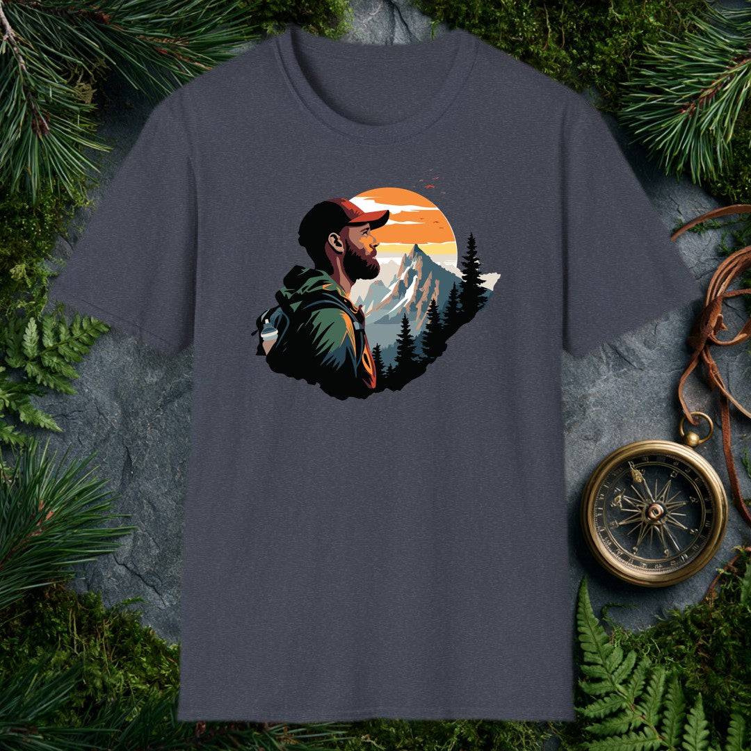 A bearded hiker with a loaded pack pauses to take in a snow-capped peak rising above a pine forest under a wide orange sunrise — for the person who knows…