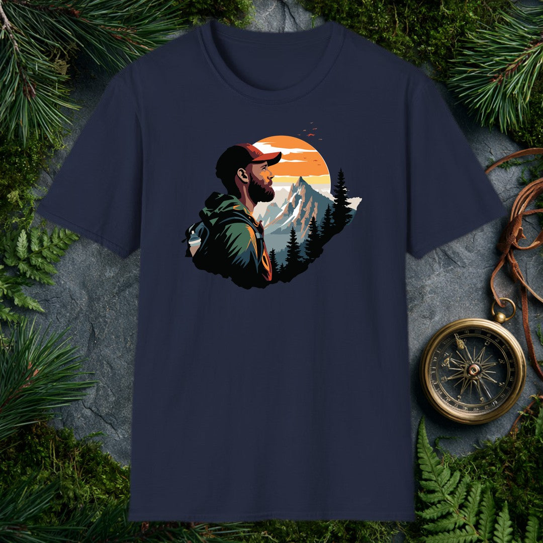 A bearded hiker with a loaded pack pauses to take in a snow-capped peak rising above a pine forest under a wide orange sunrise — for the person who knows…