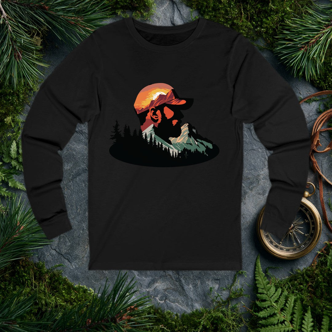 A bearded man in a ball cap becomes the landscape itself — mountains rise through his profile, pines crowd the ridge below, and a warm sunset burns behind the…