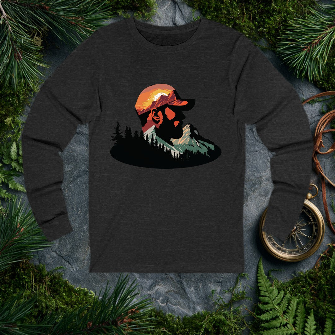 A bearded man in a ball cap becomes the landscape itself — mountains rise through his profile, pines crowd the ridge below, and a warm sunset burns behind the…