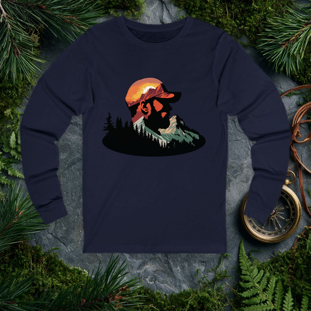A bearded man in a ball cap becomes the landscape itself — mountains rise through his profile, pines crowd the ridge below, and a warm sunset burns behind the…