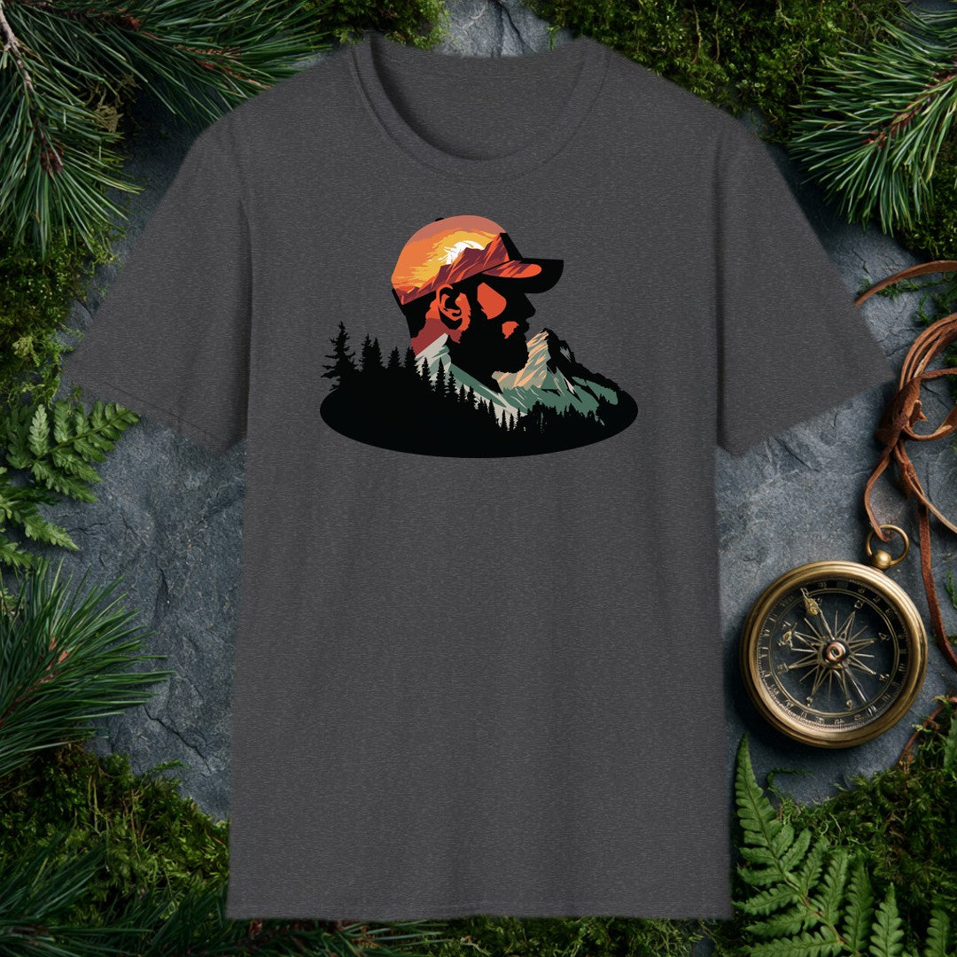 A bearded man in a ball cap becomes the landscape itself — mountains rise through his profile, pines crowd the ridge below, and a warm sunset burns behind the…
