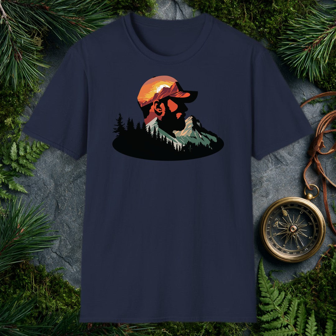 A bearded man in a ball cap becomes the landscape itself — mountains rise through his profile, pines crowd the ridge below, and a warm sunset burns behind the…