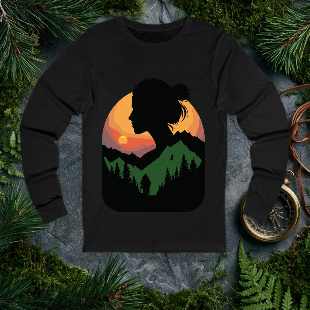 A woman's silhouette frames a layered mountain sunset — pine forest below, a lone backpacker on the trail, a bird crossing the orange sky above the ridgeline.…