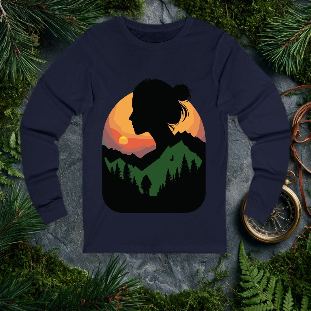 A woman's silhouette frames a layered mountain sunset — pine forest below, a lone backpacker on the trail, a bird crossing the orange sky above the ridgeline.…