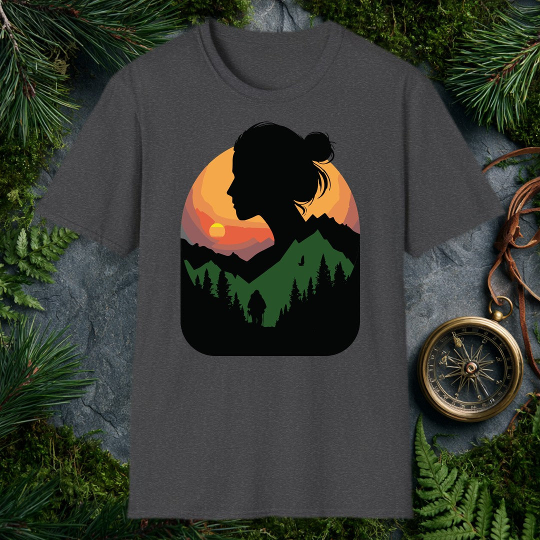 A woman's silhouette frames a layered mountain sunset — pine forest below, a lone backpacker on the trail, a bird crossing the orange sky above the ridgeline.…