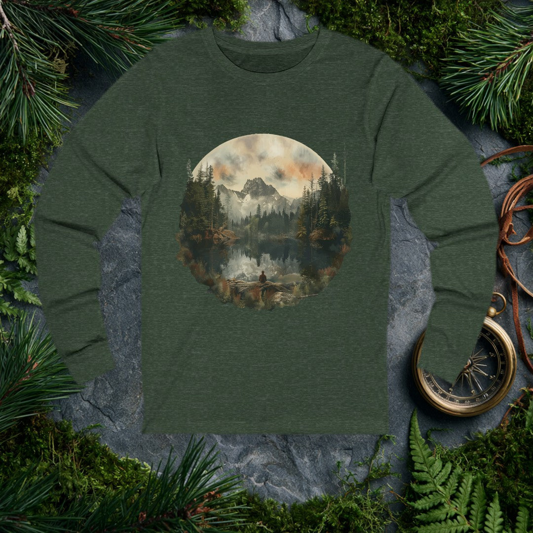A lone figure sits on a fallen log at the edge of a still alpine lake, watching jagged snow-capped peaks and a stand of dark pines mirror themselves perfectly…