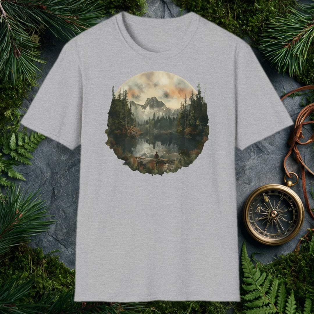 A lone figure sits on a fallen log at the edge of a still alpine lake, watching jagged snow-capped peaks and a stand of dark pines mirror themselves perfectly…