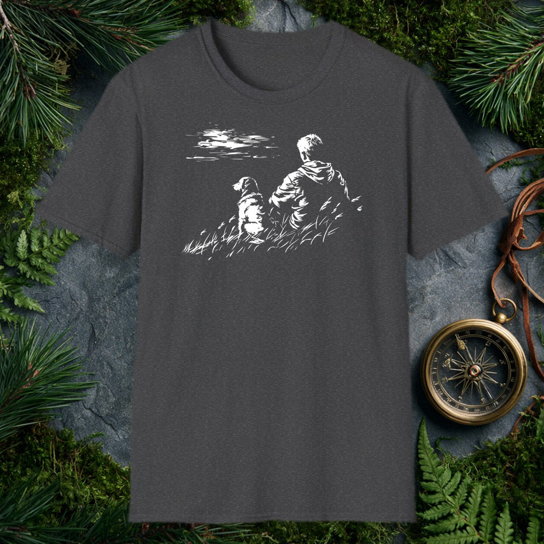 A kid and his dog sit side by side in tall grass, both watching something out across the water — the quiet kind of afternoon you don't forget. For anyone who…