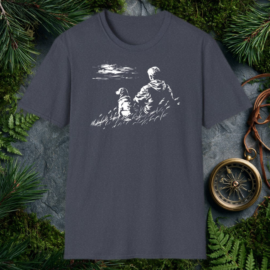 A kid and his dog sit side by side in tall grass, both watching something out across the water — the quiet kind of afternoon you don't forget. For anyone who…