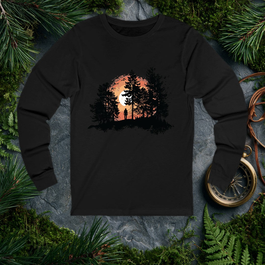 A solitary figure stands among tall pines as a wide sun sets behind them, birds lifting off to the right — for the one who crests a ridge and just stops to…