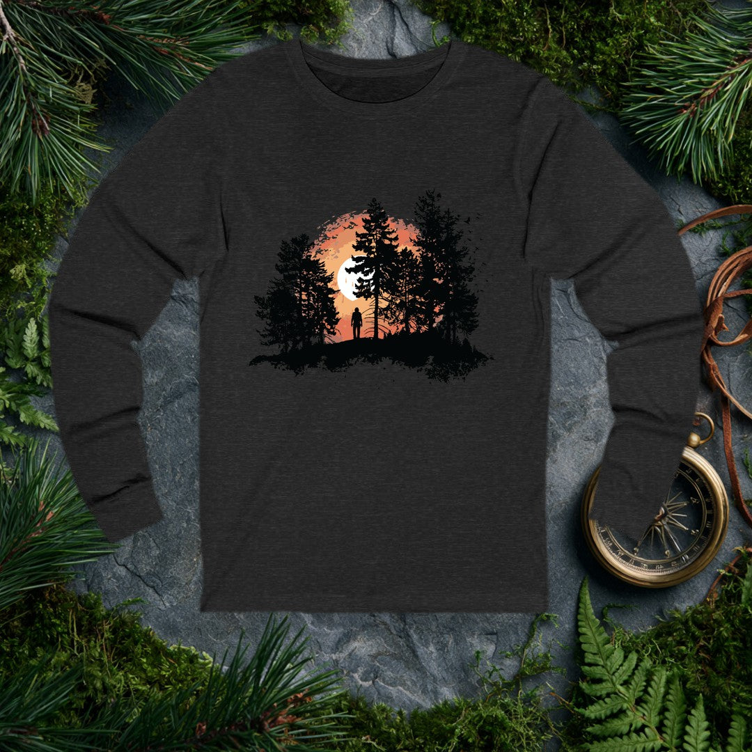 A solitary figure stands among tall pines as a wide sun sets behind them, birds lifting off to the right — for the one who crests a ridge and just stops to…