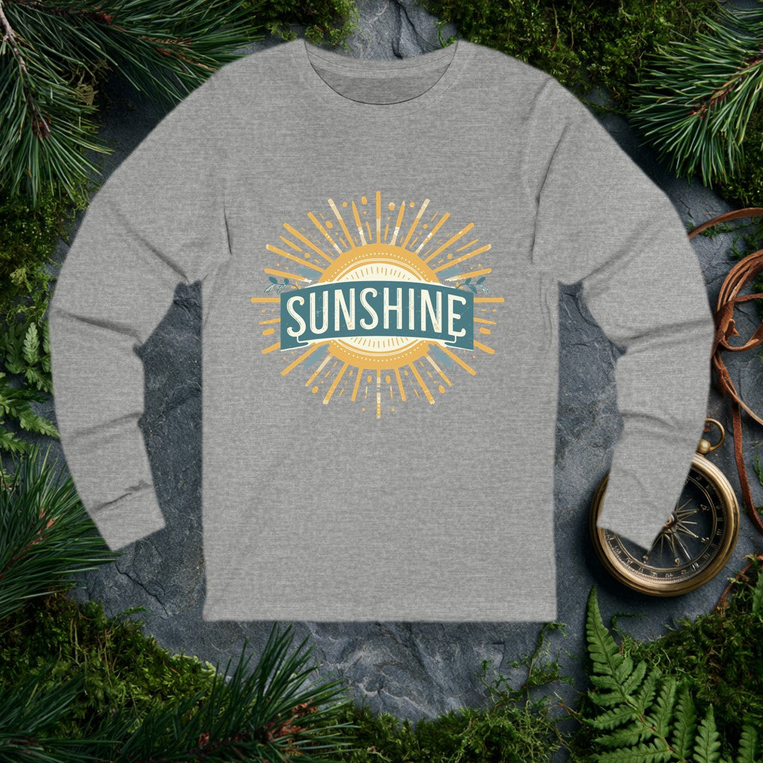 A bold vintage sun bursts outward in warm gold rays, its center framed by a teal banner and sprigs of olive leaves — for the person who chases light on every…