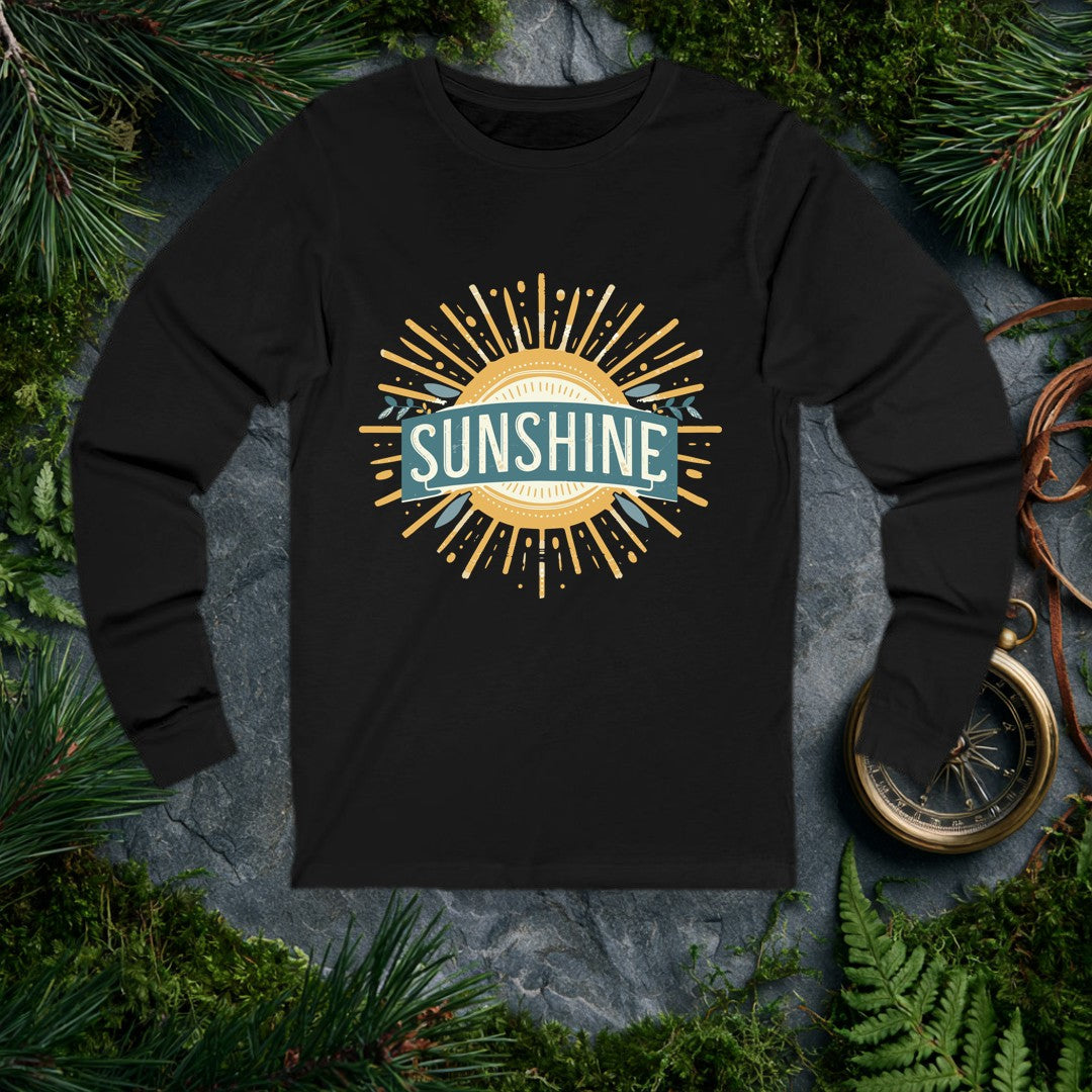 A bold vintage sun bursts outward in warm gold rays, its center framed by a teal banner and sprigs of olive leaves — for the person who chases light on every…