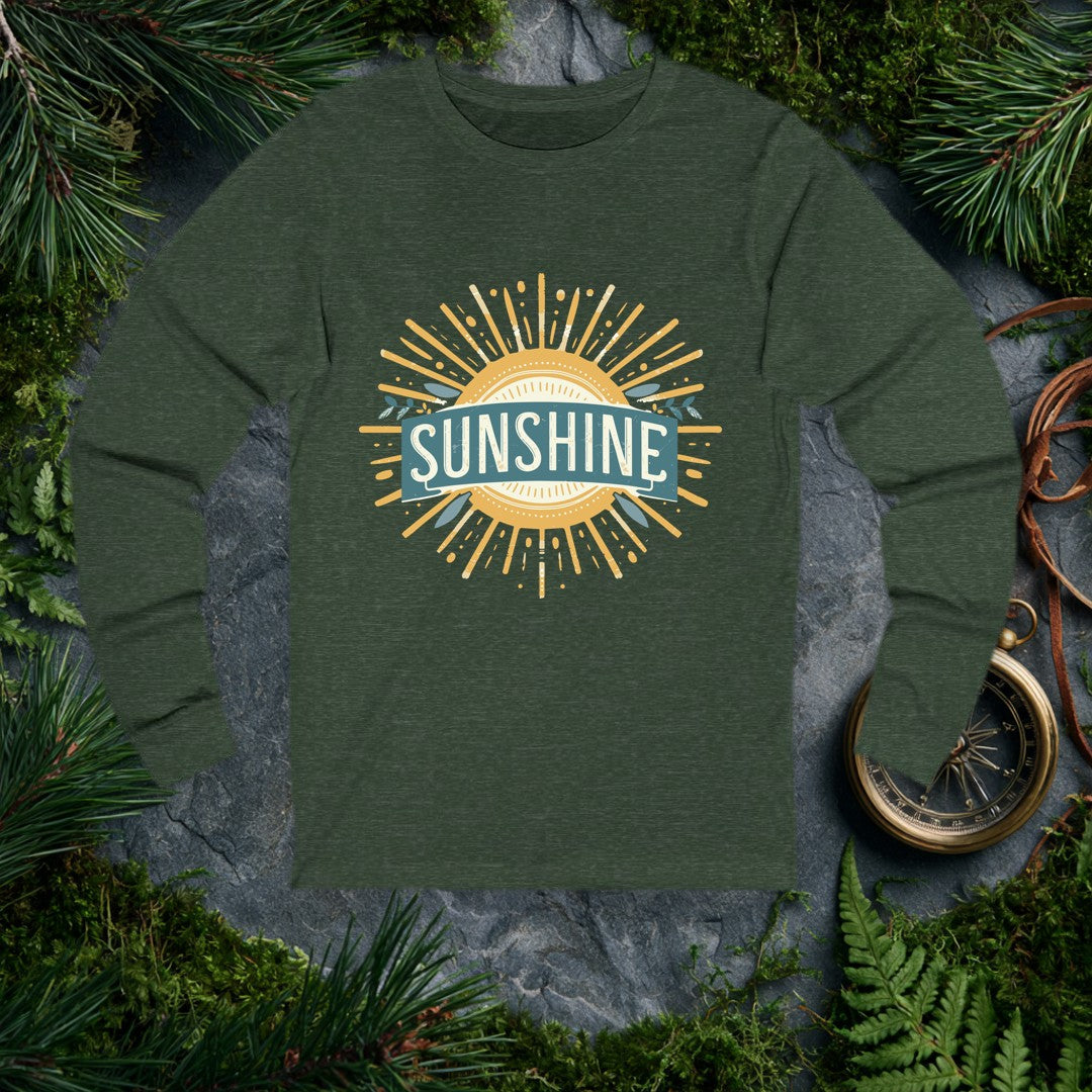 A bold vintage sun bursts outward in warm gold rays, its center framed by a teal banner and sprigs of olive leaves — for the person who chases light on every…