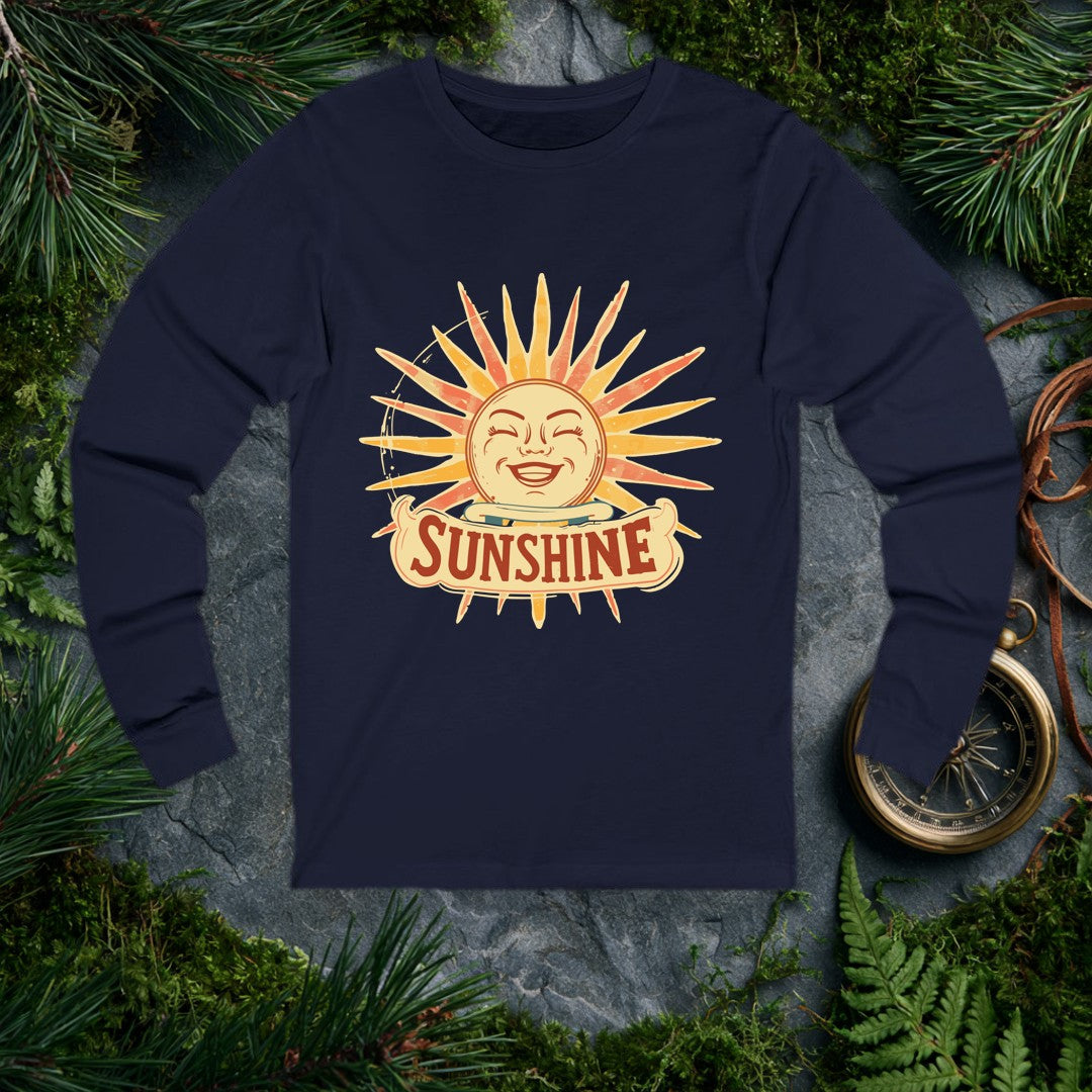 A grinning retro sun — rosy cheeks, laughing eyes, rays blazing in amber and coral — beams above a hand-lettered banner that reads Sunshine . For the optimist…