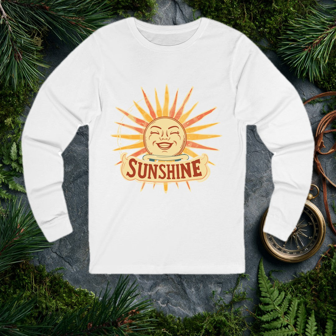 A grinning retro sun — rosy cheeks, laughing eyes, rays blazing in amber and coral — beams above a hand-lettered banner that reads Sunshine . For the optimist…