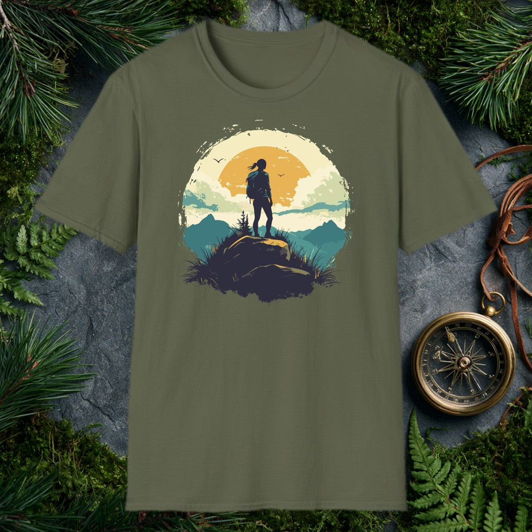 silhouette of a female hiker on a boulder against a large amber sun, teal mountain ridges, and two birds in a vintage ci
