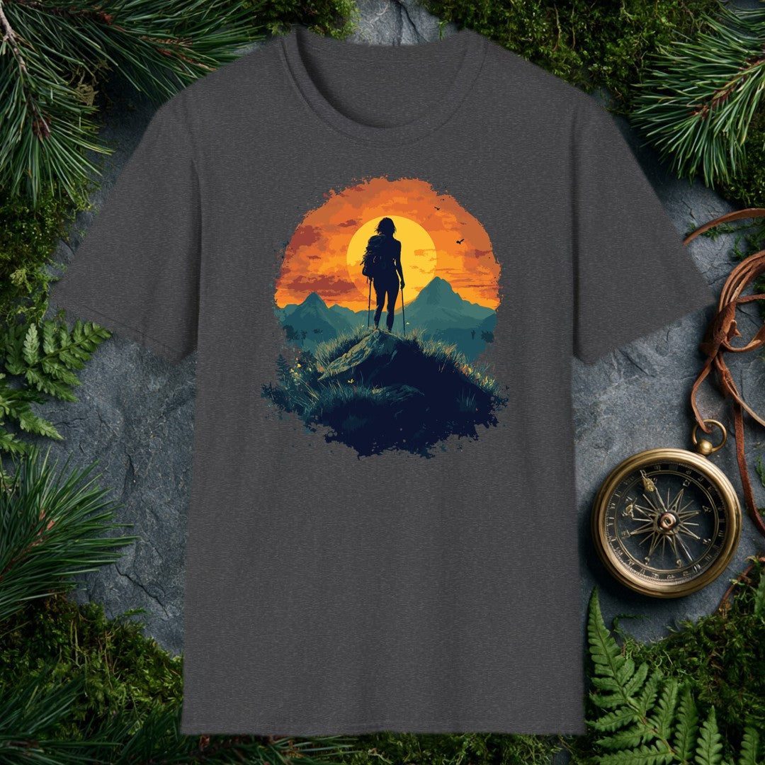 female hiker silhouette with trekking poles and backpack against a large orange sunset circle, teal mountain ridgeline b