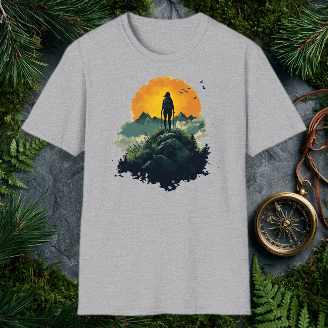 woman hiker silhouette with trekking poles atop a rocky ridge, large amber sun and mountain peaks behind her, birds in f